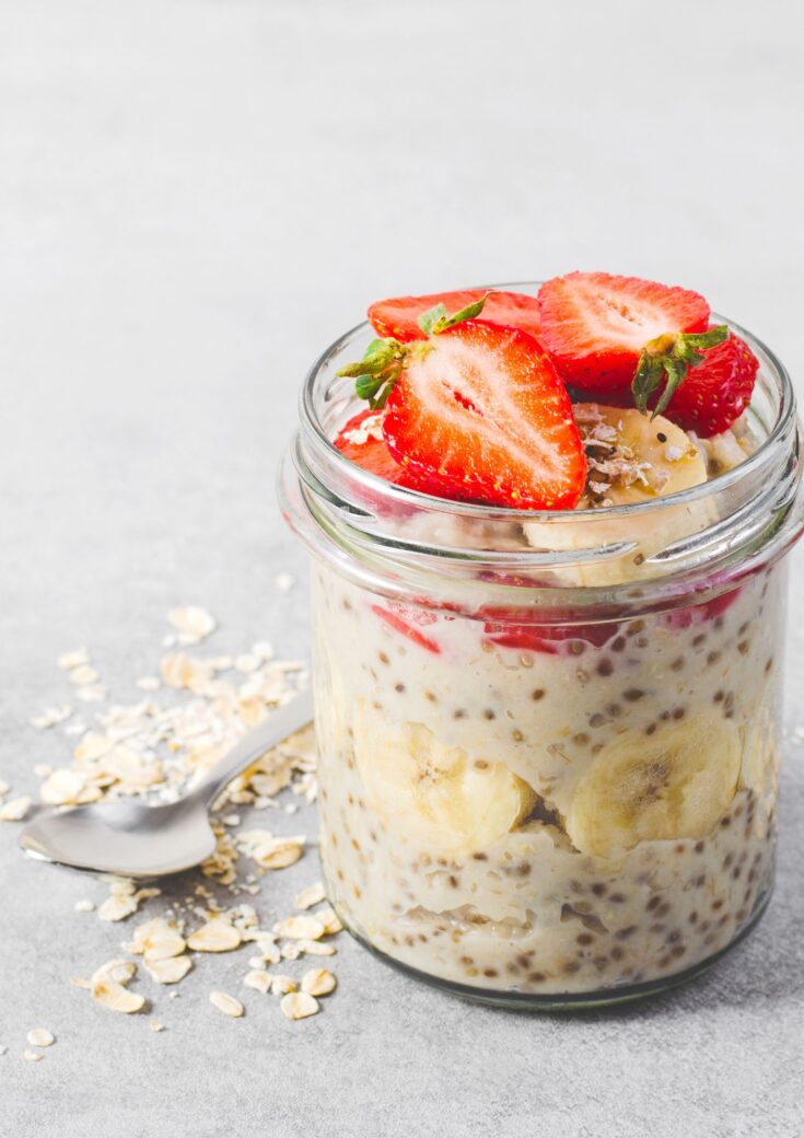 Overnight oats in jar with strawberries on top