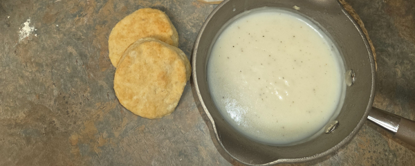 Country gravy and biscuits on the counter