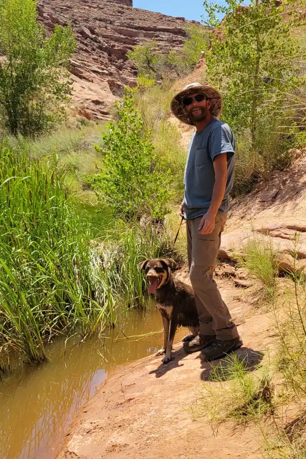 a tourist and a dog exploring the area around the national parks