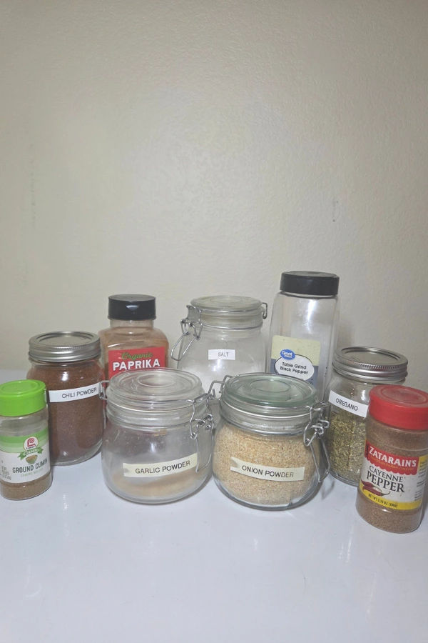 ingredients for homemade fajita seasoning blend including cumin paprika garlic powder and chili powder
